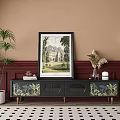 Dark TV Stand With Tropical Print Doors Framed Artwork Potted Plants And Floor Lamp