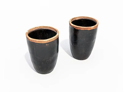 Two Black Cylindrical Ceramic Vessels with Brown Rimmed Accents on White Background 3d model
