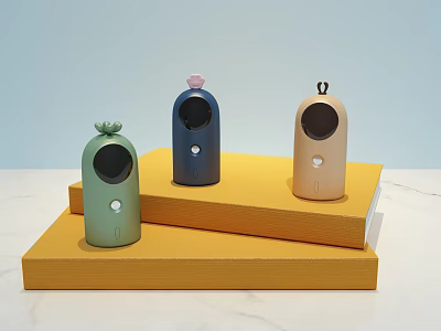 Three Different Colored Small Daily Electrical Appliances With Decorative Tops On Yellow Display Stands 3d model