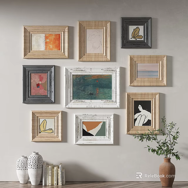 Wall Art Display With Various Framed Artworks On Neutral Wall 3d model