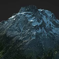 Scenic Mountain Landscape With Snow Capped Peak Rocky Terrain And Green Vegetation