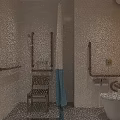Staff Office Accessible Restroom With Tiled Walls Grab Bars Toilet And Yellow Accent Wall