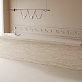 Beige Bar Counter with Hanging Pendant Lights and Greek Style Molding in Bright Window Light