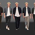 Group of Men Models Showcasing Fashionable Jackets And Pants While Walking