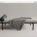 Modern Ottoman With Upholstered Cushion Wooden Legs Gray Fringed Blanket And Blue Roller Pillow