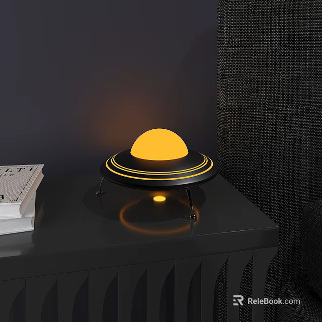 UFO Shaped Decorative Ornament Set With Yellow Illuminated Sphere And Black Base On Table 3d model 