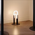 Modern Interior Floor Lamp With Curved White Light And Black Base On Wooden Floor