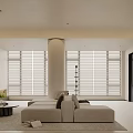 Modern Minimalist Living Room With Light Sofa Round Coffee Table And Large Windows With Blinds