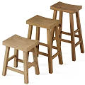Three Wooden Stools With Different Heights And Natural Wood Finish For Kitchen Bar Use