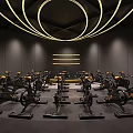 Modern Gym Studio With Multiple Spin Bikes And Circular Yellow Lighting
