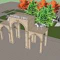 European Style Entrance Gate With Arch Design Stone Material And Sculptures Surrounding Orange Green Trees