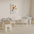 Kids Table And Chair Set In Indoor Playroom With Toys Decorative Painting And Carpet
