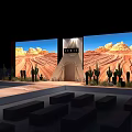 Large Screens Show Desert Landscape With Teepee Structure Cacti Plants And Bench Seating