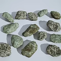Natural Stones With Various Sizes Different Shapes And Textured Surfaces On White Background