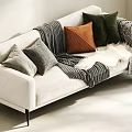 White Two Seater Sofa with Decorative Pillows Striped Blanket Fur Throw and Black Legs