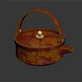 Red And Gold Patterned Teapot With Curved Handle And Decorative Lid Knob
