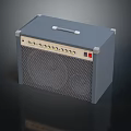 Gray Audio Speaker With Mesh Front Panel Top Handle Control Knobs And Red Indicator Light