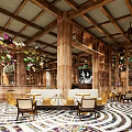 Vibrant Café Interior With Colorful Circular Ceiling Decor Wooden Bar Brunch Menu And Spiral Floor