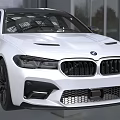 White BMW M5 Sport Sedan Front Design Featuring Sporty Grille Headlights And Vents In Showroom