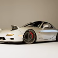 White Modified Sports Car with Alloy Wheels Red Brake Calipers and Sporty Exterior Design