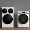 Two Modern White Washing Machines With Black Circular Doors And Digital Control Panels