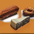 Delicious Chocolate Eclair Caramel Donut And New York Cheesecake Slice On Orange Background