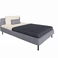 Single Bed With Gray Upholstered Frame Dark Gray Mattress And White Pillow