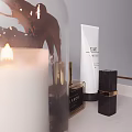 Elegant Perfume Cosmetics With Glass Bottles Gold Accents Skincare Products And Scented Candle