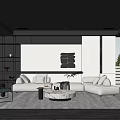Modern Living Room Interior With Light Colored Sofa Round Coffee Table And Black White Wall Decor