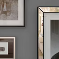 Framed Portrait Paintings In Various Sizes Displayed On Gray Wall With Landscape Artworks