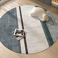 Round Area Rug With Blue Gray Striped Design And White Bear Plush On Photo Box