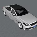Silver Luxury Sedan With Black Roof Modern Design And Elegant Front Styling