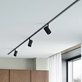 Track Spotlights Ceiling Mounted in Modern Interior with Wooden Cabinets and Window Curtains
