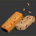 Two Delicious Pastry Pieces With Colorful Red Green Yellow Bits Falling