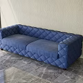 Modern Blue Multi Person Sofa With Diamond Stitched Design On Marble Floor 3d model