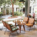 Cozy Cafe Interior With Wooden Chairs Green Cushions And Garden View