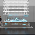 Visitors viewing modern exhibition display with transparent lighting structure and blue cloud shaped elements