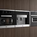 Modern Built in Kitchen Appliances Featuring Oven And Coffee Machine In Dark Wood Cabinets