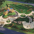 Outdoor Children's Play Area With Natural Grass Climbing Structures And Balance Paths