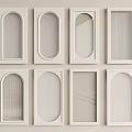 White Decorative Window Frame Panels In Various Shapes Arranged On Wall 3d model
