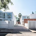 Modern Semi Detached Villa With White Exterior Palm Trees And Driveway