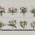 Vibrant Flower Arrangements In Clear Glass Vases On Layered Shelves