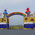 Colorful Amusement Park Entrance Gate with Rainbow Arch Mushroom Towers and Cartoon Decorations