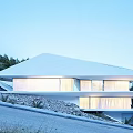Modern Geometric Single Family Villa With White Roof Large Windows And Hillside Rocky Landscape