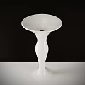 Elegant White Ceramic Vase Standing On White Tabletop With Black Background