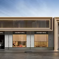 Modern Commercial Storefront Design Featuring Glass Facade Metal Frame Large Windows And Illuminated Signage