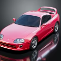 Red Two Door Sports Car With Rear Spoiler Silver Wheels And Reflection