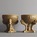 Gold Decorative Urns With Carved Lion Heads And Ornate Patterns On Tabletop