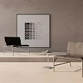 Modern Black And Gray Accent Chairs With Abstract Artwork On Gray Wall And Small Table