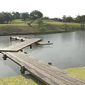 Scenic Road Facilities Featuring Wooden Boardwalk Over Water Area with Grassland and Trees